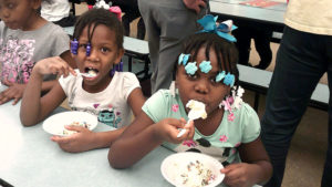 Two first grade students enjoying their ice cream.