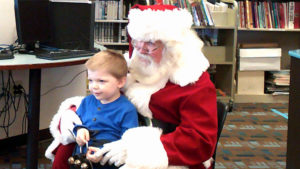 A student gets to tell Santa what he wants for Christmas.