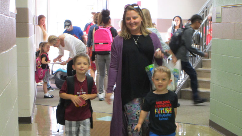 Jessica Wynn walks her son Eli Wynn to class on his first day of Kindergarten.
