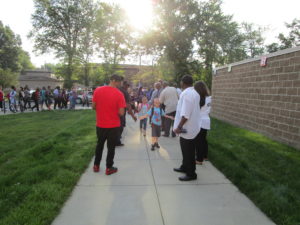 Men of Warren greeting our students on the first day of school.