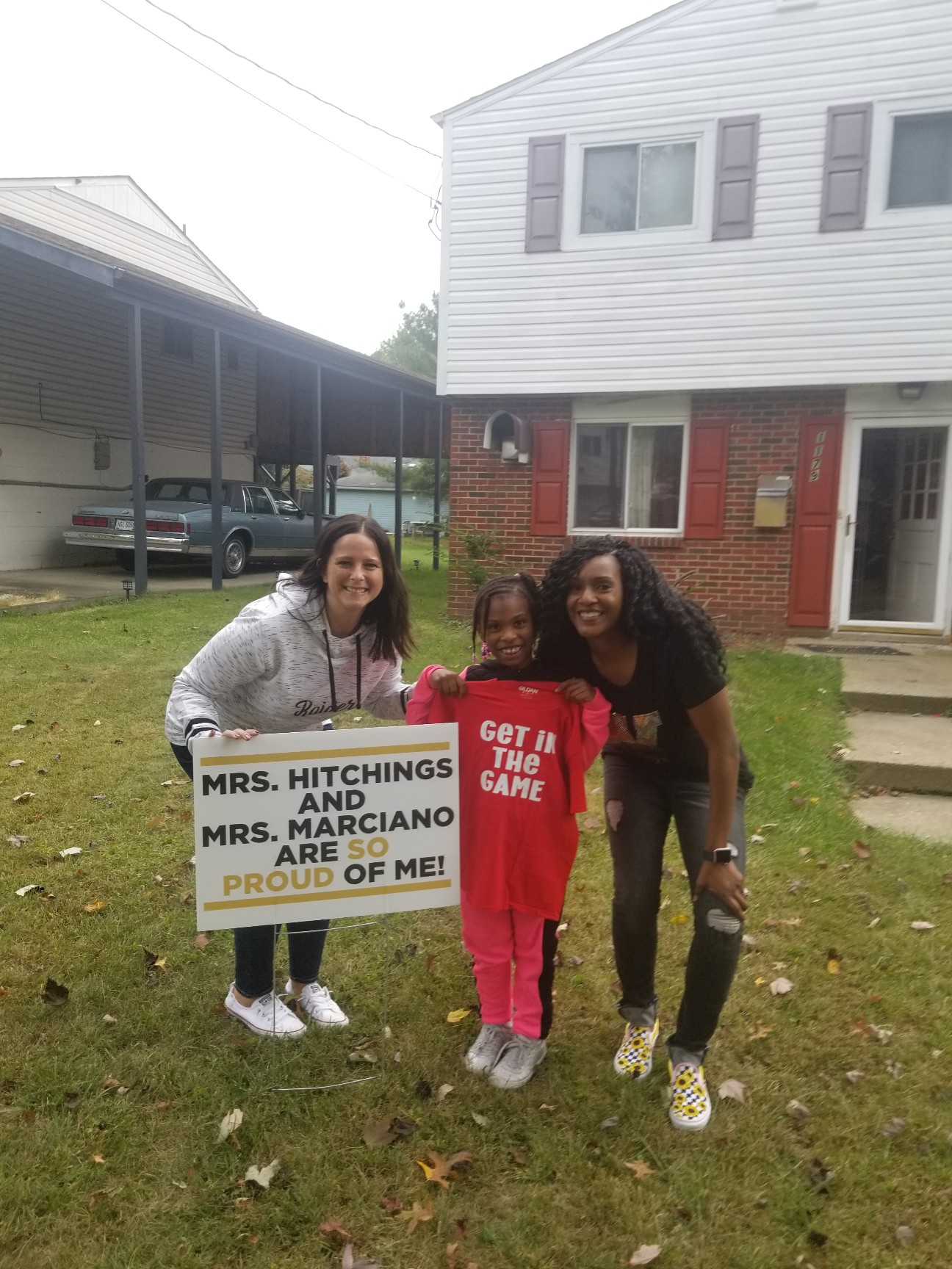 Students Receive Yard Sign from their Teachers