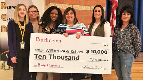 Burlignton Stores presents a check from $10,000 to Willard PK-8 School