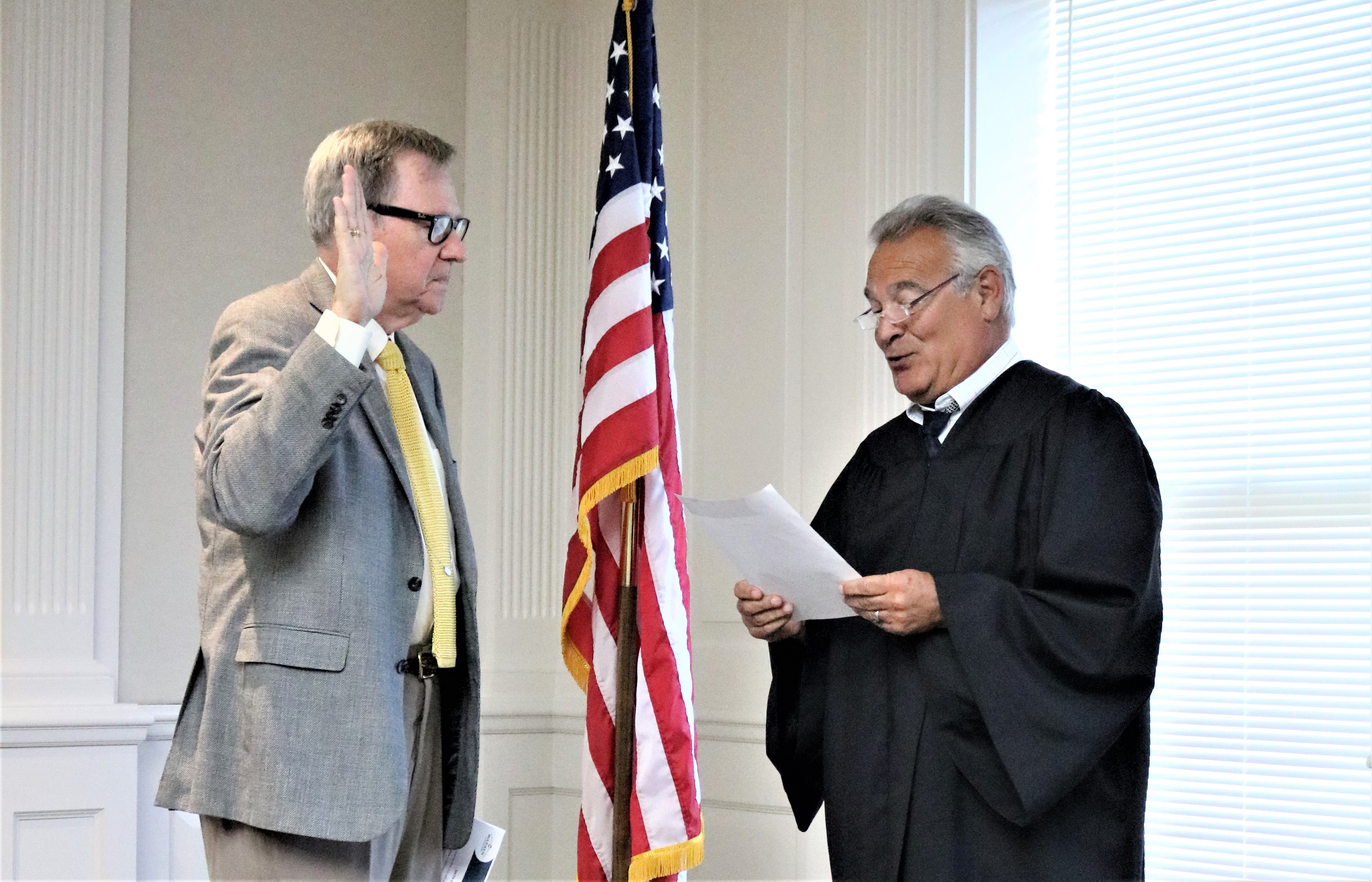 John E. Fowley is sworn in by Trumbull County Judge James A. Fredericka
